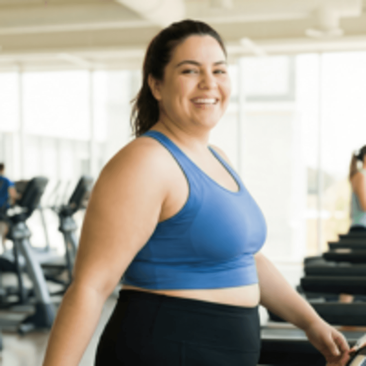 Woman smiling on a treadmill