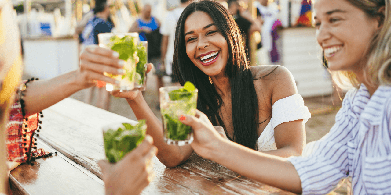 A group of female friends, out for drinks on a sunny day