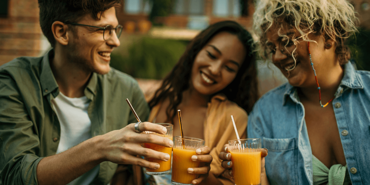 a group of friends socialising with drinks