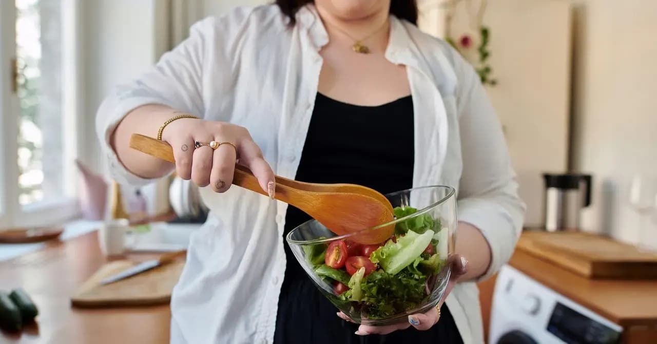 Woman making a salad