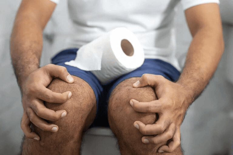 A man with diarrhoea, a possible side effect of Orlistat.
