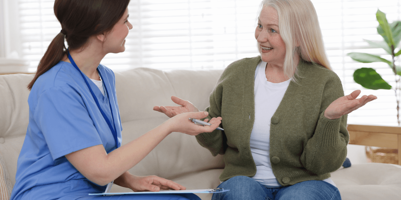 Middle aged woman talking to her GP