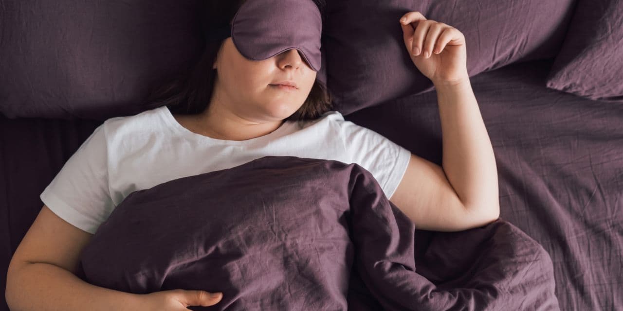 Woman sleeping with an eye mask on